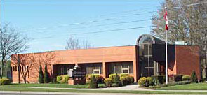 The Sutherland Insurance office, a single-storey brick building at 240 Victoria Road North in Guelph, Ontario